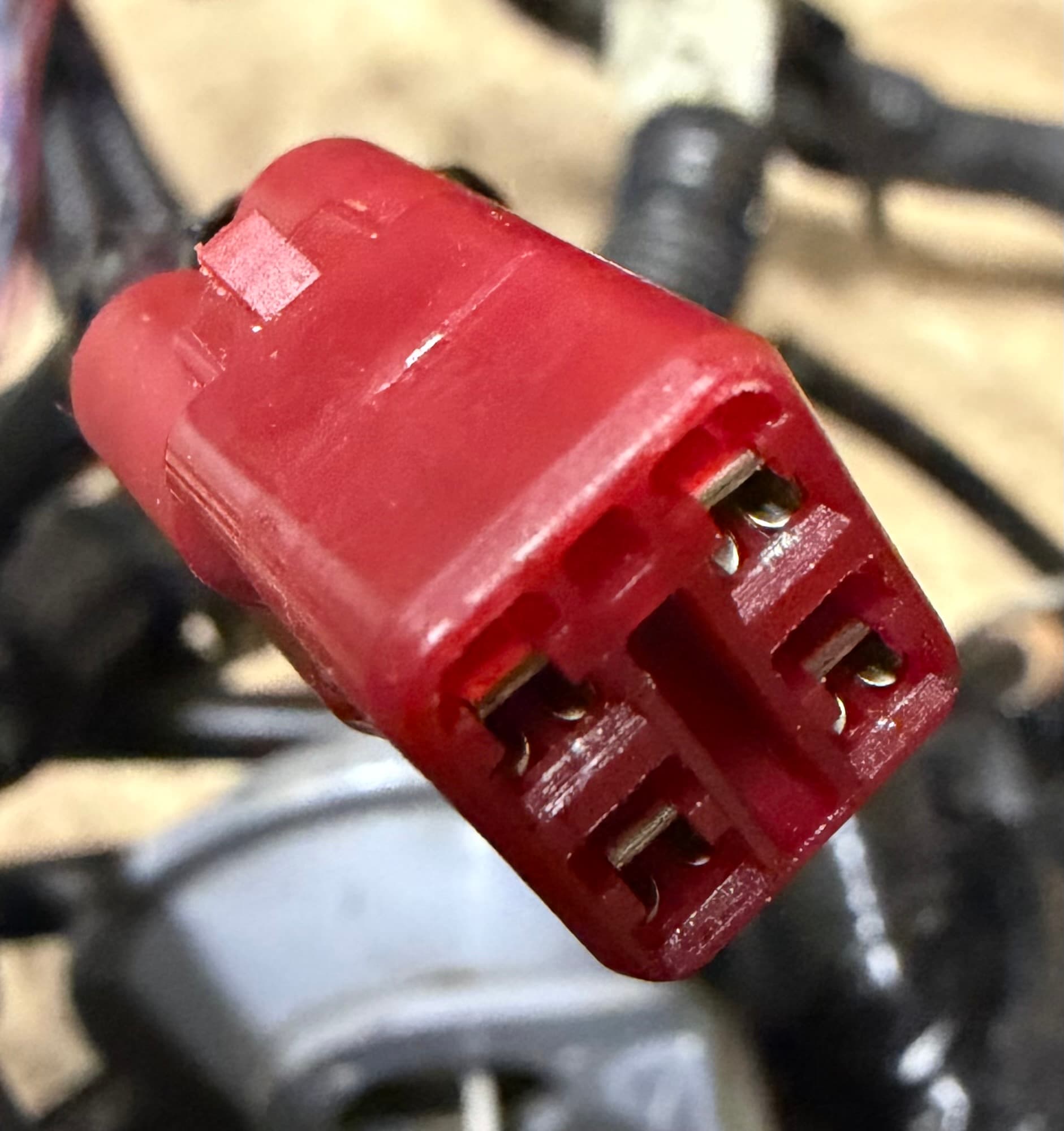 The red 4-pin DLC diagnostic connector on a Honda AquaTrax